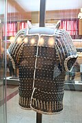 Modern copy of one variant of lamellar armor, called "sleeved armor" (lit. tǒngxiùkǎi", 筒袖铠), dating to Western Han dynasty era