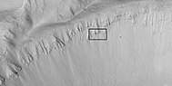 Crater wall with columnar jointing in the location of the box. Columnar joints are easily seen in the enlarged image that follows. Picture taken with HiRISE.
