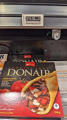 A box in a freezer case with an image of a donair on it.