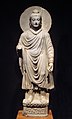 The Buddha wearing kāṣāya robes, c. 200 BCE.