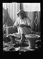 A Mandaean silversmith at work in his Baghdad store, 1932