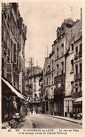 Old postcard showing French street scene in a not very upmarket area