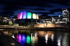 Michael Fowler Centre lit in the colors of the rainbow flag in March 2019.