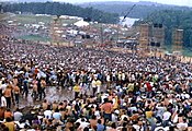 Crowds at the stage during the Woodstock Music Festival, two months after the Stonewall riots in June 1969.