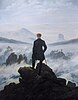 A painting of a man standing with his back to the viewer. He is atop a mountain and surrounded by clouds and fog. He is dressed in black and contrasts sharply with the whites, pinks, and blues of the atmosphere. In the distance outcroppings of rocks can be seen.
