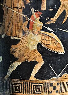 Photo of a pottery painting of a man holding a spear and shield