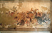 A large mosaic depicting an array of soldiers on horseback doing battle. Parts of it have been damaged or lost to time.