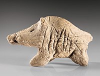 A clay boar figurine from the Neolithic period, found at Tepe Sarab, kept at the Museum of Ancient Iran.