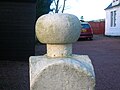 Detail of a curling stone on top of a gatepost at Cutstraw in Stewarton, East Ayrshire. 2007.