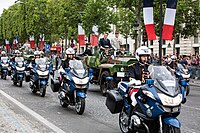 President Emmanuel Macron and General François Lecointre, Chief of the Defence Staff, reviewing troops at the 2019 Bastille Day military parade.