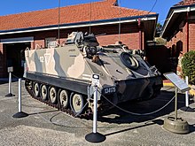 Colour photo of a tracked military vehicle