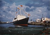 The Royal Yacht Britannia flying the Royal Standard and the Flag of the Lord High Admiral, 1977
