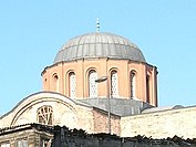 Exterior of a dome at Zeyrek Mosque showing exposed external dome profile and buttressed windows in a drum