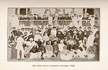 Men in traditional Indian dress posing for a photograph