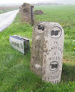 A milestone marked "A.D. 1836", on the B3306 near Land's End Airport