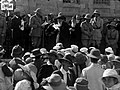 From left to right (holding papers): Weizmann, Allenby and the Chief Rabbi of Jerusalem delivering a speech.
