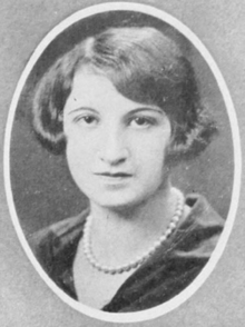 A young white woman with hair cut in a bob, in an oval frame