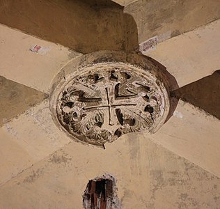 Keystone of a vault in the nave, with the cross emblem of the Counts of Toulouse