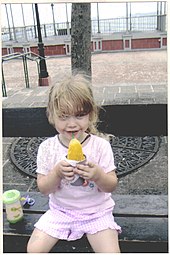 Little girl eating a piragua in Puerto Rico, 2008