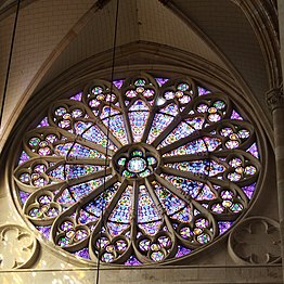 Rose window in the left transept, created by Émile Thibaut.