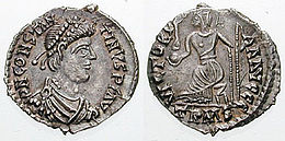Both sides of a silver coin. One side showing a man's profile, the other a stylised figure bearing a spear and a globe.