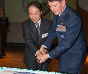 Koji Tomita of the Japanese foreign ministry pictured with U.S. Air Force General Jan-Marc Jouas during the 2013 UN Command–Rear cake reception in celebration of United Nations Day