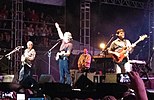 Members of the band Alabama performing in concert