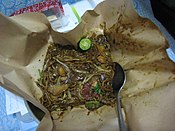 Singaporean-style char kway teow, cooked with a mixture of yellow wheat noodles and flat rice noodles