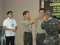 UP Village Bgy Captain and Lawyer Virgilio S Ferrer II is promoted to the rank of major in the reserve force, Philippine Army.