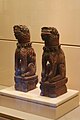 Nghê (mythological beast) figurines, crimson and gilded wood, eighteenth century.