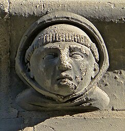 Romanesque mascaron of the Église de la Trinité d'Angers, Angers, France, c.1150-1175, unknown architect or sculptor[26]