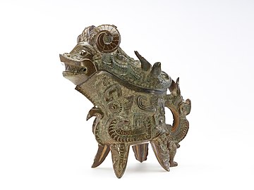 Ritual wine ewer (guang) with taotie, dragons, and real animals. Late Shang dynasty, 11th century BCE