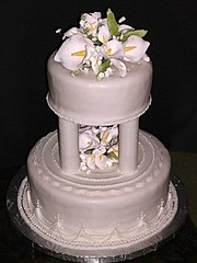 Tiered wedding cake with calla lilies