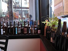 Photograph of bottles lining window sills