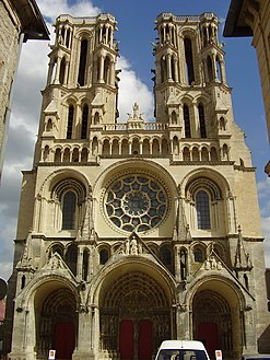 The façade of Laon Cathedral, 1225, a Gothic cathedral, maintains rounded arches and arcading in the Romanesque manner.