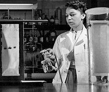 Alma Hayden spraying chromatogram with reagent