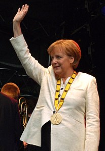 Angela Merkel with the 2008 prize medal around her neck