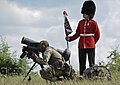 Two Coldstream Guardsmen show the traditional uniform and the capabilities with a Javelin system during a small-arms display in Cincu, Romania