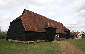 Grange barn, Coggeshall, England. This is a studded barn so the wall sheathing must be applied horizontally and covered with a siding material, in this case clapboards (weatherboards).