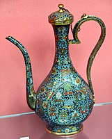 Lidded ewer. Wine pot with floral design; the body decorated with the "Eight Auspicious Symbols" amidst scrolling flowers. Cloisonne enamel on copper. Ming dynasty, 1550–1600 CE. From China