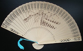 Brisé fan, a typical commercially produced scented wood folding fan; this one features a painting of the Great Wall of China