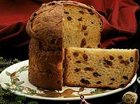 Panettone cut over a Christmas plate