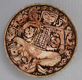 12th–13th century bowl depicting King Zahhak with snakes protruding from his shoulders, likely from Northwestern Iran. Modified c. 1926, as many medieval pieces were to make them more attractive.[7]