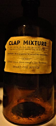 Brown glass medicine bottle with label reading, "CLAP MIXTURE," a list of ingredients, "CAUTION -- It is dangerous to exceed the stated dose / DOSES / 1/2 fluid ounce three times a day, in water / SHAKE THE BOTTLE"