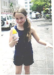 Girl with a parcha-flavored piragua in Puerto Rico