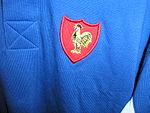 The jersey of the French rugby team, with the traditional rooster symbol.