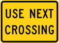 W10-14aP Use next crossing (plaque)