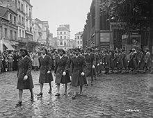 African-American WACs parade through the streets