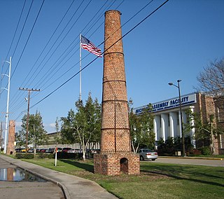 Old plantation smokestacks stand outside the administration offices of NASA's Michoud Assembly Facility, c.2006.