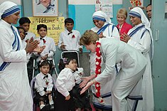The First lady of USA, Ms. Laura Bush interacting with the disabled children on her visit to Mother Teresa Light of Life Home (Jeevan Jyothi) for disabled children, in New Delhi on March 2, 2006.